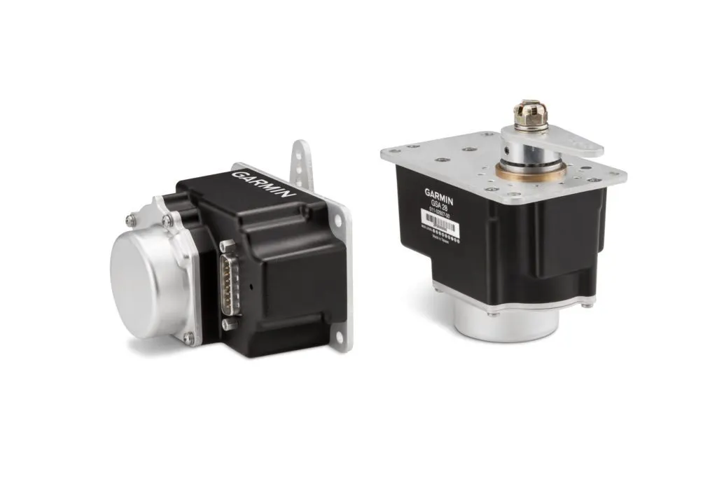 Two Garmin GSA 28 autopilot servos, one showing the D-sub connector face and the other showing the output shaft and mounting plate