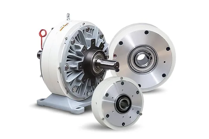 Three magnetic particle brakes of increasing size, the largest mounted on a pedestal base with an output shaft
