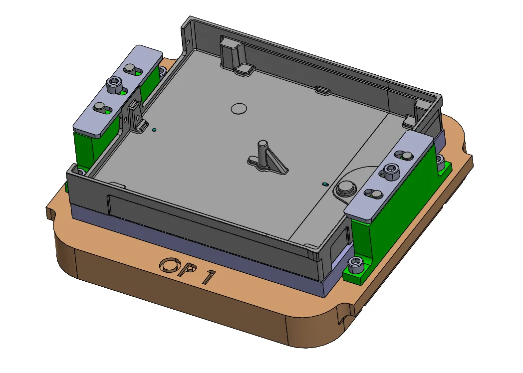 CAD model of the OP 1 secondary operation fixture, with a housing clamped between two side clamps on a machined base plate